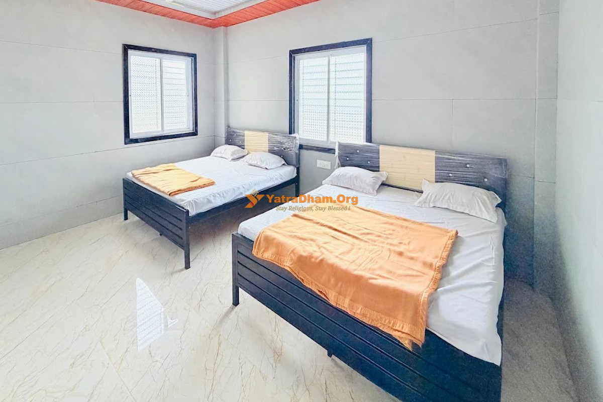 Hotel Maa Saheb Lodging and Home Stay Saptashrungi 4 Bed Room View