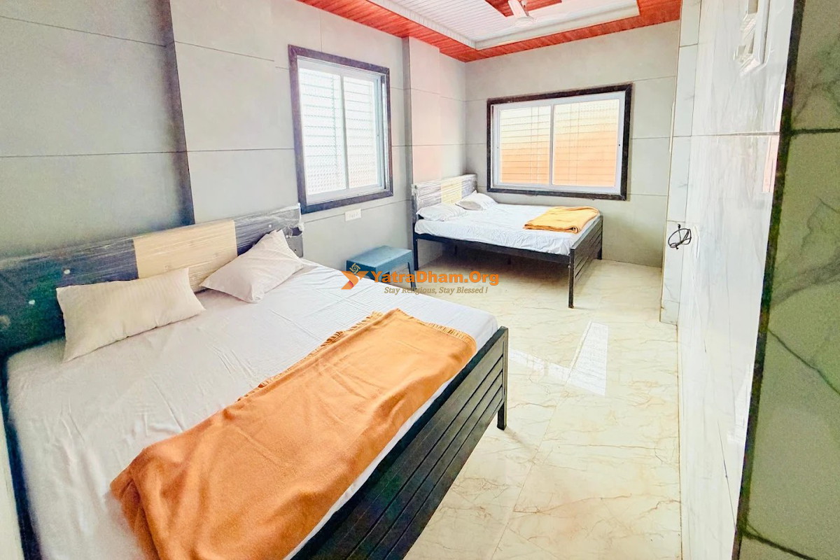 Hotel Maa Saheb Lodging and Home Stay Saptashrungi 4 Bed Room View