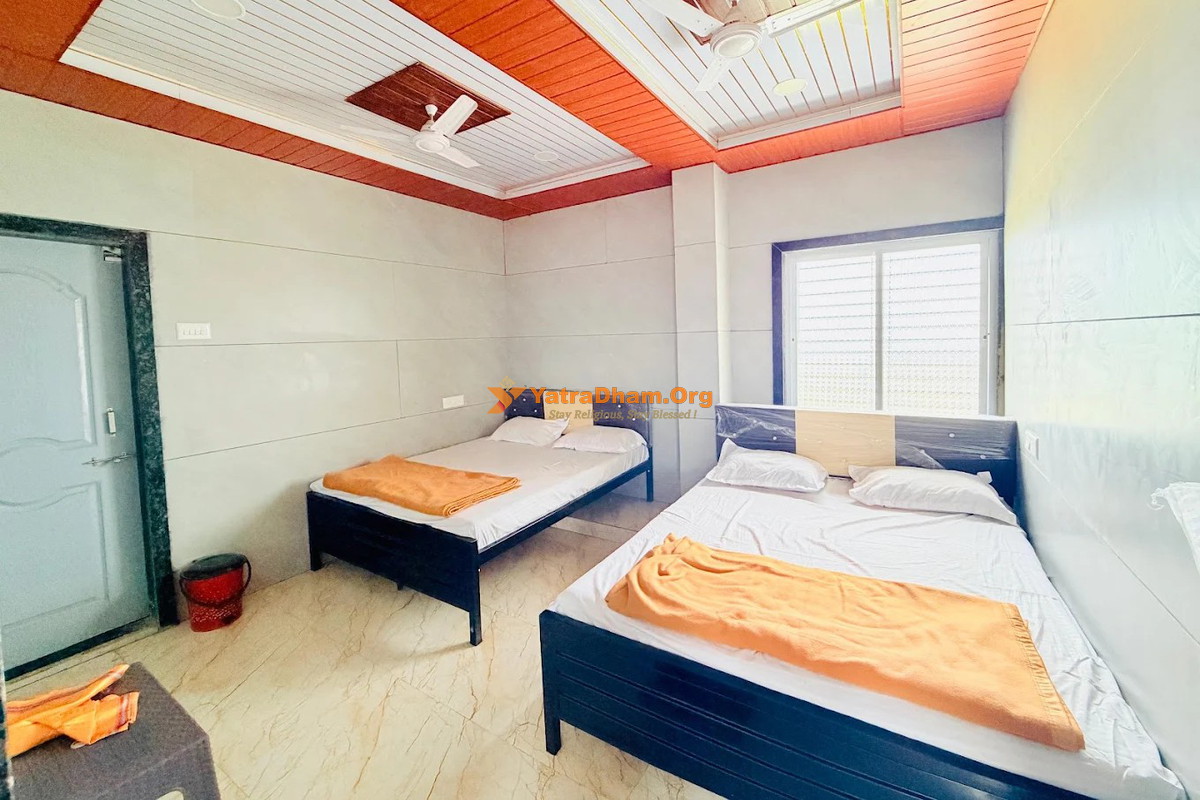 Hotel Maa Saheb Lodging and Home Stay Saptashrungi 4 Bed Room View